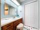 Bathroom featuring a white countertop and wooden vanity with a tiled floor at 1743 Wilshire Ct, Lakeland, FL 33813
