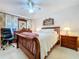 Bright bedroom with wood furniture, a bed, and a ceiling fan at 1743 Wilshire Ct, Lakeland, FL 33813