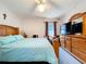 Spacious bedroom with a large dresser, a window with blinds and a bed at 1743 Wilshire Ct, Lakeland, FL 33813