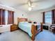 Bedroom with a bed, two windows with blinds and two night stands at 1743 Wilshire Ct, Lakeland, FL 33813