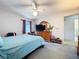 Bright bedroom featuring natural light, a ceiling fan and a dresser at 1743 Wilshire Ct, Lakeland, FL 33813