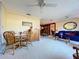 Open-concept living space connects dining area with comfortable seating, creating a warm and inviting atmosphere at 1743 Wilshire Ct, Lakeland, FL 33813