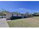 Well-kept single-story brick home with a tidy lawn, and a walkway leading to the entrance at 1743 Wilshire Ct, Lakeland, FL 33813