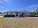 Charming single-story brick home with manicured lawn and mature landscaping at 1743 Wilshire Ct, Lakeland, FL 33813