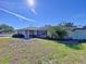 Traditional ranch home with manicured lawn and mature landscaping in a suburban neighborhood at 1743 Wilshire Ct, Lakeland, FL 33813