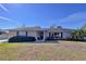Attractive single-story brick home with neat landscaping and a dark front door at 1743 Wilshire Ct, Lakeland, FL 33813