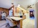 The kitchen showcases wood cabinets, updated appliances, and tile flooring with views into the dining room at 1743 Wilshire Ct, Lakeland, FL 33813