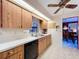Kitchen with bright lighting, wood cabinets, and stainless steel appliances and adjacent dining area at 1743 Wilshire Ct, Lakeland, FL 33813