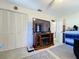 Living room features closet, a television and entertainment center at 1743 Wilshire Ct, Lakeland, FL 33813