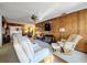 Inviting living room with wood accents, large seating and view to the bright kitchen at 1743 Wilshire Ct, Lakeland, FL 33813