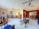 The open-concept living room features neutral carpet and furnishings throughout the home at 1743 Wilshire Ct, Lakeland, FL 33813