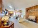 Cozy living room features a ceiling fan, carpeted floors and brick fireplace at 1743 Wilshire Ct, Lakeland, FL 33813
