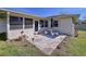 Charming back patio with a stone surface and outdoor seating area at 1743 Wilshire Ct, Lakeland, FL 33813