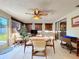 Comfortable sunroom with tile flooring, ceiling fan, slider to yard, and dining table at 1743 Wilshire Ct, Lakeland, FL 33813