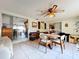 Inviting sunroom featuring neutral tile flooring, a ceiling fan and casual dining furniture at 1743 Wilshire Ct, Lakeland, FL 33813