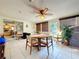 Light-filled sunroom features neutral tile, ceiling fan, and sliding door to the living room at 1743 Wilshire Ct, Lakeland, FL 33813