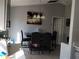 Cozy dining area with stylish chandelier lighting and room for Gathering gatherings at 661 Crane Dr, Kissimmee, FL 34759