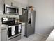 Modern kitchen with stainless steel appliances, sleek countertops, and ample storage for all your culinary needs at 661 Crane Dr, Kissimmee, FL 34759