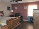 Comfortable main bedroom with wood-look flooring, ample natural light, and space for relaxation at 661 Crane Dr, Kissimmee, FL 34759
