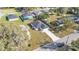 Aerial view of a single-story home with a long driveway and a dark gray roof at 420 Tecumseh N Ave, Fort Meade, FL 33841