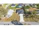 Aerial view of a single-story home with a dark gray roof and a long driveway at 420 Tecumseh N Ave, Fort Meade, FL 33841