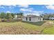 Backyard view featuring a well-maintained lawn and fenced-in yard at 420 Tecumseh N Ave, Fort Meade, FL 33841