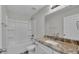 Bathroom featuring a tub and shower combination and a granite vanity at 420 Tecumseh N Ave, Fort Meade, FL 33841