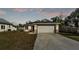 Charming single-story home with a well-maintained lawn and a two-car garage at 420 Tecumseh N Ave, Fort Meade, FL 33841