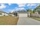 Charming single-story home with a well-maintained lawn and a two-car garage at 420 Tecumseh N Ave, Fort Meade, FL 33841
