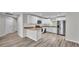 Bright, modern kitchen with stainless steel appliances, granite countertops, and ample cabinet space at 420 Tecumseh N Ave, Fort Meade, FL 33841