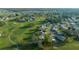Golf course community featuring single-story homes with a picturesque setting, complemented by well-maintained landscaping at 1717 Lilly Ln, Lady Lake, FL 32159