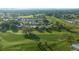 An aerial view of the community showcasing homes and a golf course at 1717 Lilly Ln, Lady Lake, FL 32159