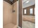 En Suite Bathroom featuring a tiled shower and separate soaking tub, plus custom windows at 1717 Lilly Ln, Lady Lake, FL 32159