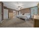 Bedroom with two beds, closet, dresser, ceiling fan, and windows at 1717 Lilly Ln, Lady Lake, FL 32159