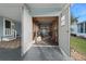 The open garage shows ample space for storage and projects at 1717 Lilly Ln, Lady Lake, FL 32159