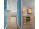 Open floor plan features wood floors and laundry room at 1717 Lilly Ln, Lady Lake, FL 32159