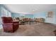 Cozy living room with comfortable seating arrangements and lots of natural light at 1717 Lilly Ln, Lady Lake, FL 32159