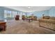 Inviting living room filled with natural light, showcasing neutral tones and comfortable furnishings at 1717 Lilly Ln, Lady Lake, FL 32159