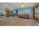 Spacious living room with beautiful natural light, wood flooring, and stylish decor at 1717 Lilly Ln, Lady Lake, FL 32159