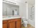 Well-lit bathroom features a shower-tub combination with a stylish single sink vanity at 2938 Rodrick Cir, Orlando, FL 32824