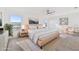 Serene bedroom with neutral tones, large windows, and soft textures provides a calming retreat for rest and relaxation at 2938 Rodrick Cir, Orlando, FL 32824