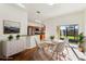 Open dining area with sliding glass doors, adjacent to the kitchen, offers seamless indoor-outdoor living and plenty of natural light at 2938 Rodrick Cir, Orlando, FL 32824
