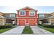 Charming multi-Gathering home featuring two-story design, private driveways, and welcoming curb appeal at 2938 Rodrick Cir, Orlando, FL 32824
