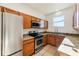 Kitchen features stainless steel appliances, granite counters, and natural light at 2938 Rodrick Cir, Orlando, FL 32824