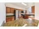 Well-lit kitchen with modern appliances, granite counters, stainless steel fridge, and ample cabinet storage at 2938 Rodrick Cir, Orlando, FL 32824