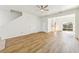 Bright open-concept living area with wood floors and natural light at 2938 Rodrick Cir, Orlando, FL 32824