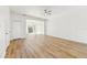 Bright living room featuring wood floors, ceiling fan, and lots of natural light at 2938 Rodrick Cir, Orlando, FL 32824