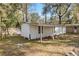 An outbuilding with a porch is found in the backyard at 3925 Ne 92Nd Pl, Anthony, FL 32617