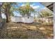 Trees surround the home and outbuildings in this backyard view at 3925 Ne 92Nd Pl, Anthony, FL 32617