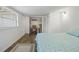 Bedroom featuring hardwood floors, a closet full of boxes, and a large window at 3925 Ne 92Nd Pl, Anthony, FL 32617